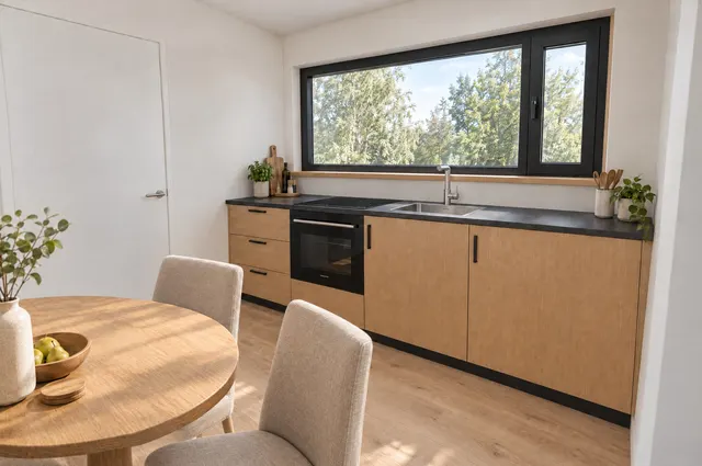 LIND interior: kitchen under a full-width window