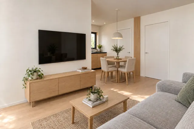 LIND interior: living room with TV and round dining table